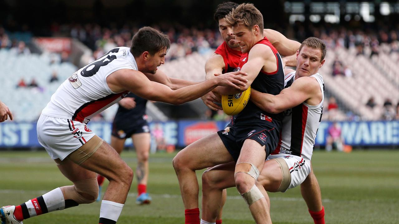 MELBOURNE, VICTORIA - JULY 26: David Armitage of the Saints tackles Dom Tyson of the Demons during the round 17 AFL match between the Melbourne Demons and the St Kilda Saints at Melbourne Cricket Ground on July 26, 2015 in Melbourne, Australia. (Photo by Darrian Traynor/AFL Media/Getty Images)