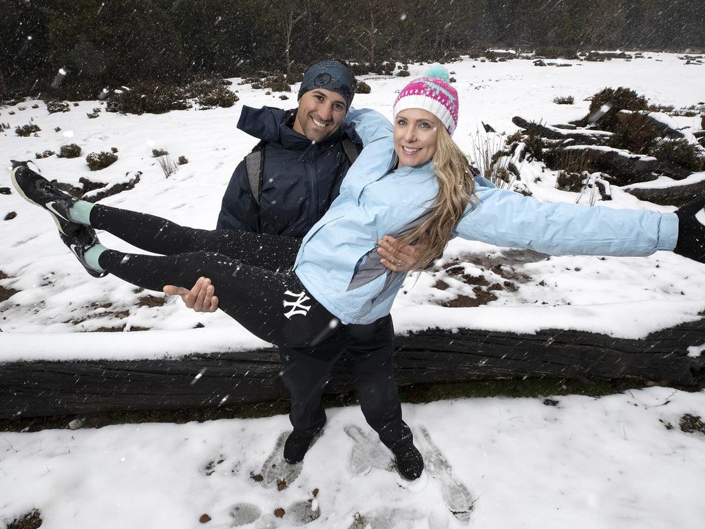 Chris and Michelle Parker of Brisbane enjoy the snow at Cradle Mountain. PICTURE CHRIS KIDD