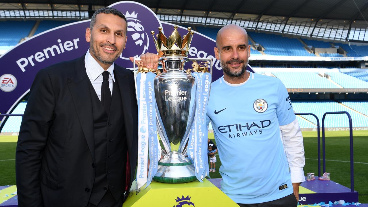 Khaldoon al-Mubarak, Manchester City chairman and Josep Guardiola, Manager of Manchester City pose with the Premier League trophy.