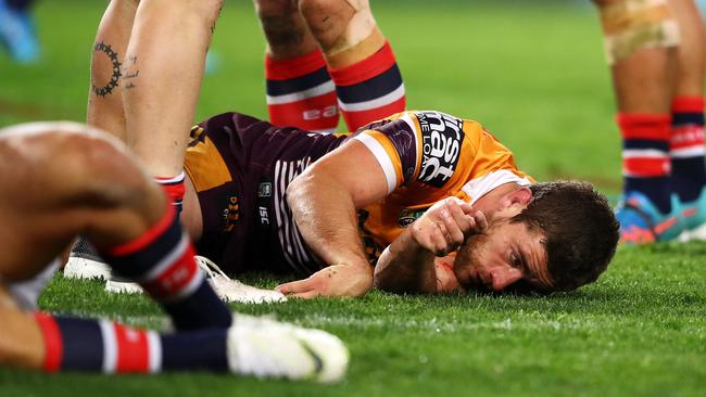 Brisbane’s Andrew McCullough after he was ironed out by Roosters forward Dylan Napa. Picture: Getty Images