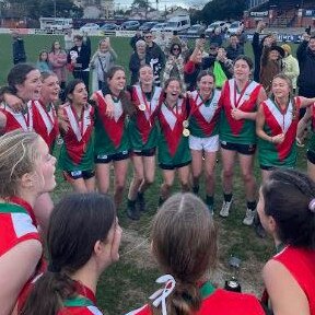 The Clonard girls celebrate their big win.