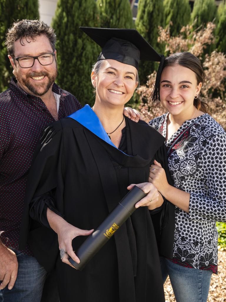 Bachelor of Nursing graduate Samantha Cochrane is congratulated by Steve Hannay and Cadence Cochrane at a UniSQ graduation ceremony at Empire Theatres, Wednesday, June 28, 2023. Picture: Kevin Farmer