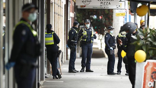 Police pack Swan Street in Richmond to keep an eye on Tigers fans during and after the AFL grand final. Picture: Getty Images