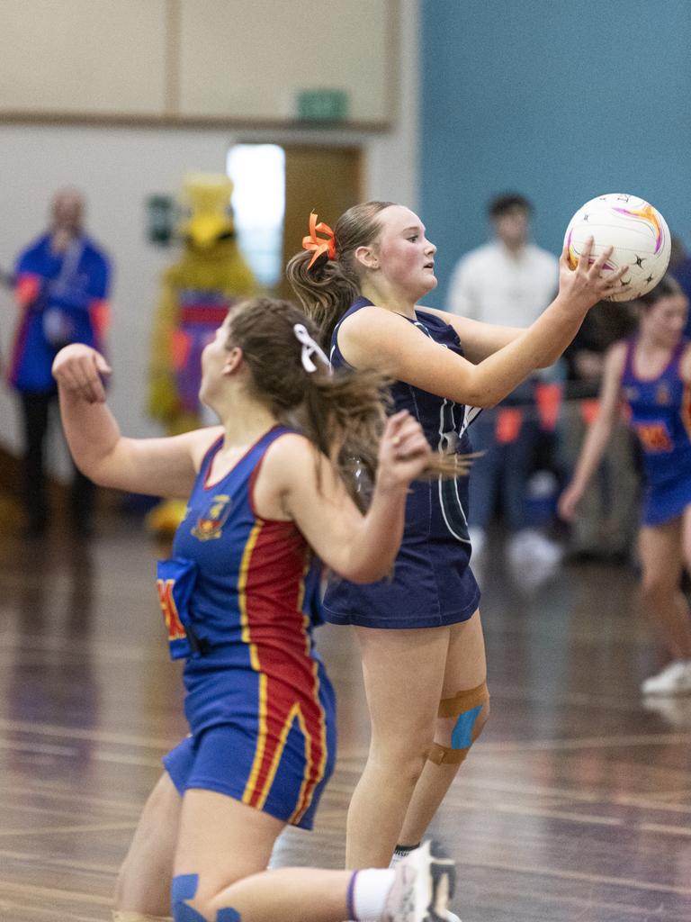 Abby Thomas gets possession for St Ursula's Junior B against Downlands Junior B in Merici-Chevalier Cup netball at Salo Centre, Friday, July 19, 2024. Picture: Kevin Farmer