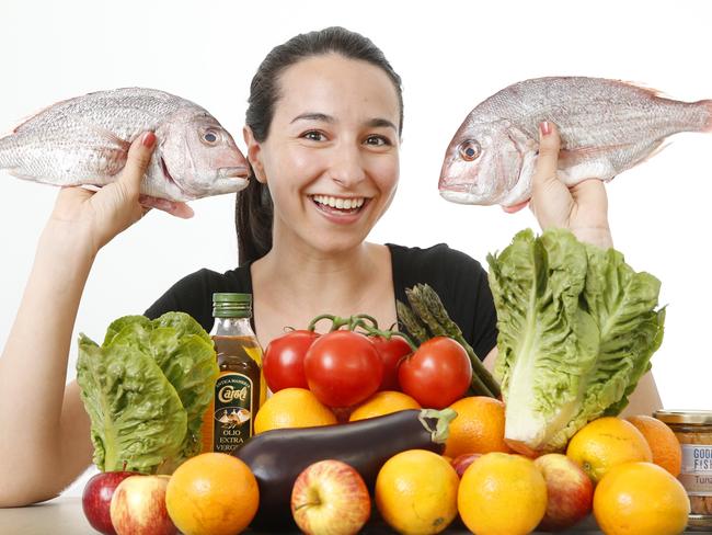 Swinburne University researcher Gioconda Ceravolo with fresh fruit and veggies, whole grains, legumes and moderate levels of oily fish, olive oil and dairy products, common in the Mediterranean diet. Picture: David Caird.