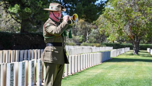 Al Kidney from the ADF plays the Last Post during the Service of Remembrance in the West Terrace Cemetery. Picture: NCA NewsWire / Brenton Edwards