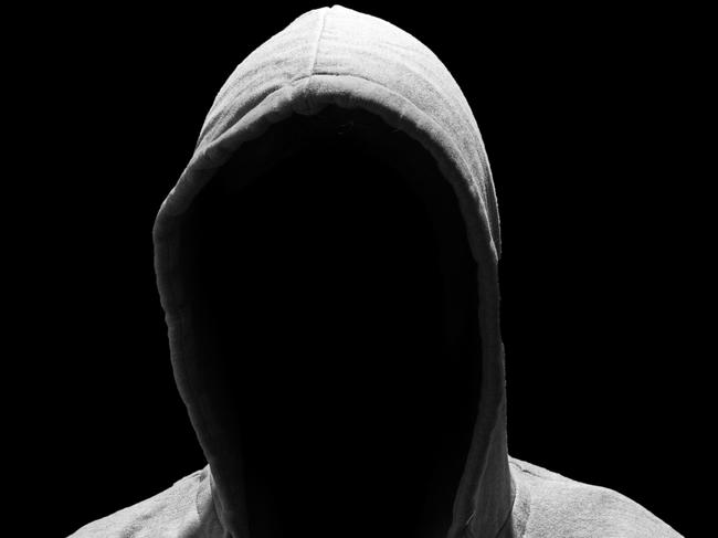 Portrait of Invisible man in the hood isolated on black background creep pervert molestor generic Photo: iStock