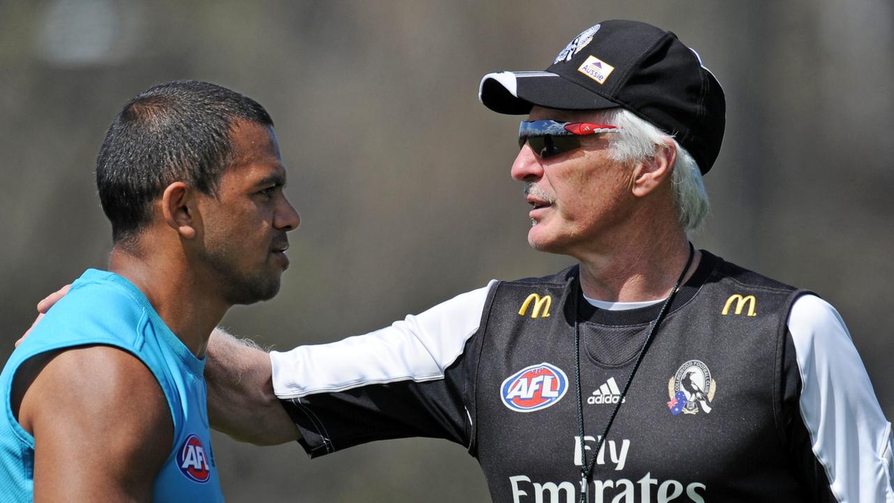 Collingwood training. Mick Malthouse puts his arm around Leon Leon Davis who was dropped for the GF rematch tomorrow.