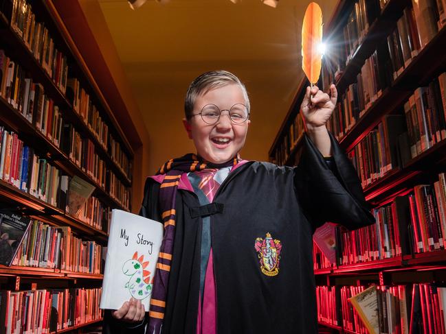 Writing is magic ... eight-year-old Stephen Tsembas gets inspiration for the Kids News Short Story Competition at the State Library of Victoria. Picture: Jason Edwards