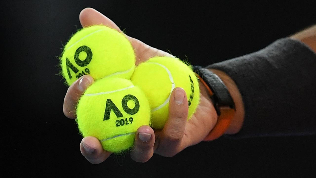 Rafael Nadal holds yellow tennis balls. Picture: AAP Image/Lukas Coch