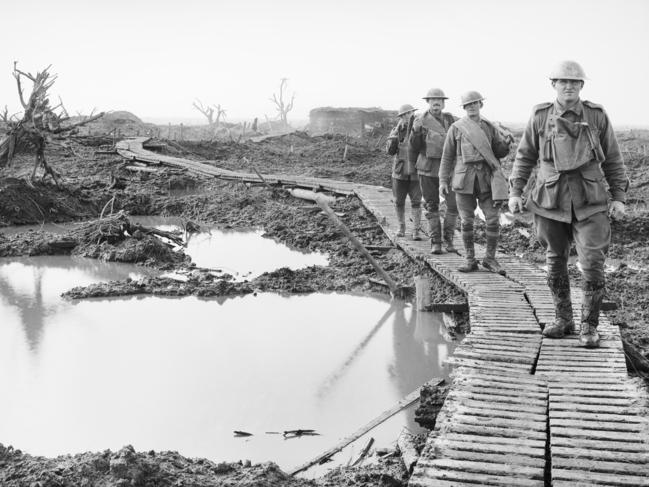 ***MANDATORY CREDIT FOR USE INCLUDES IMAGE NUMBER: Australian War Memorial E01236*** Maker: Unknown Australian Official Photographer (Photographer) Place made Belgium: Western Front (Belgium), Passchendaele Area, Zonnebeke. Date made 22 October 1917. *Description* Four Australian soldiers walking along the duckboard track at Tokio, near Zonnebeke, in the Ypres sector, over a portion of the country captured by the Australians in the fighting of the Third Battle of Ypres, in September and October 1917. The three soldiers on the left are unidentified, the soldier on the right is 32091 [image: Inline images 1]