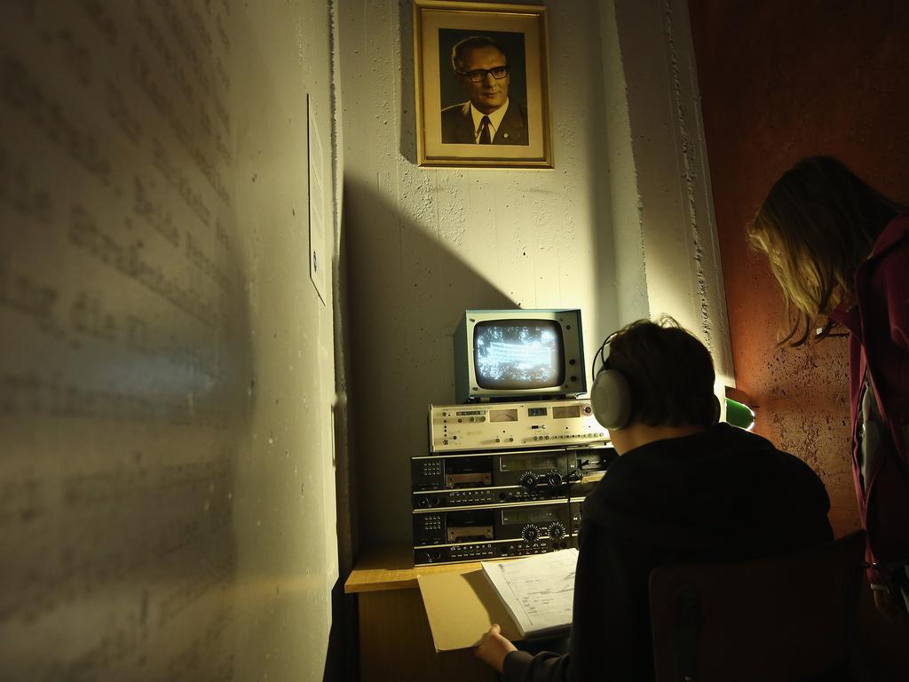 A reconstructed Stasi secret police surveillance corner is seen by tourists. The Stasi had a huge network of more than 90,000 employees and 180,000 informants. Picture: Sean Gallup/Getty Images