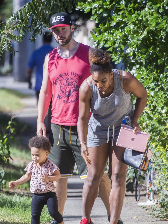 Serena Williams and her husband Alexis Ohanian enjoy an afternoon walk with their 1-year-old daughter Alexia Olympia. Serena's daughter looked seriously cute, toddling her way down the footpath, wearing Nike sneakers like her Mummy. Picture: MediaMode