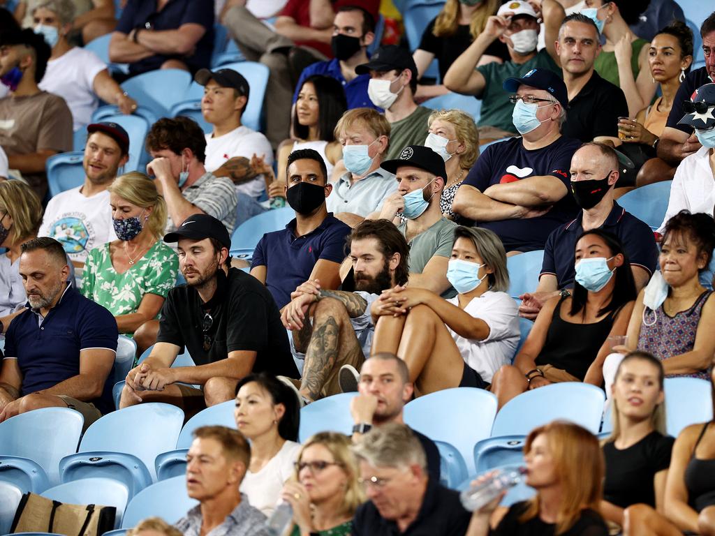 MELBOURNE, AUSTRALIA - FEBRUARY 11: Spectators in the crowd watch the Men's Singles second round match between Alex De Minaur of Australia and Pablo Cuevas of Uruguay during day four of the 2021 Australian Open at Melbourne Park on February 11, 2021 in Melbourne, Australia. (Photo by Darrian Traynor/Getty Images)