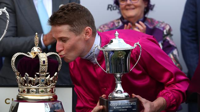 Jockey James McDonald kisses the King Charles III trophy after riding Fangirl to victory at Randwick. Picture: Jason McCawley/Getty Images