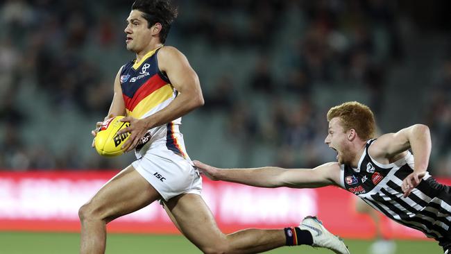 CATCH ME IF YOU CAN: Crow Shane McAdam bursts clear of Port Adelaide’s Willem Drew during last year’s SANFL qualifying final. Picture SARAH REED.