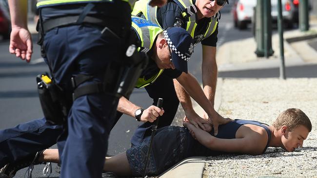 A man is taken into custody in Bendigo. Picture: Jake Nowakowski