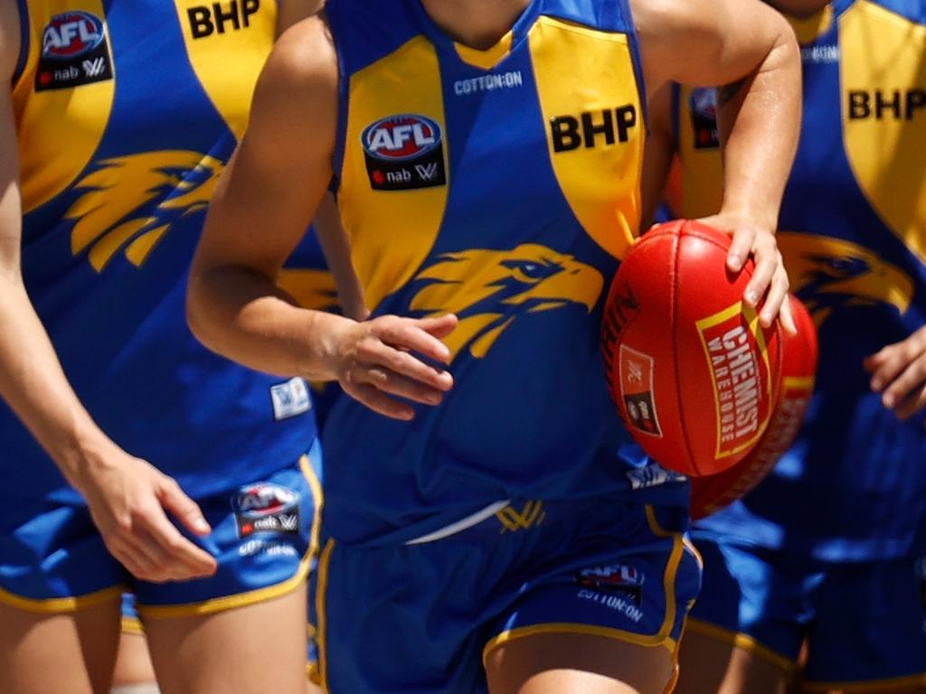 MELBOURNE, AUSTRALIA - JANUARY 16: Emma Swanson of the Eagles leads her team onto the field during the 2022 AFLW Round 02 match between the West Coast Eagles and the Gold Coast Suns at VU Whitten Oval on January 16, 2022 in Melbourne, Australia. (Photo by Michael Willson/AFL Photos via Getty Images)