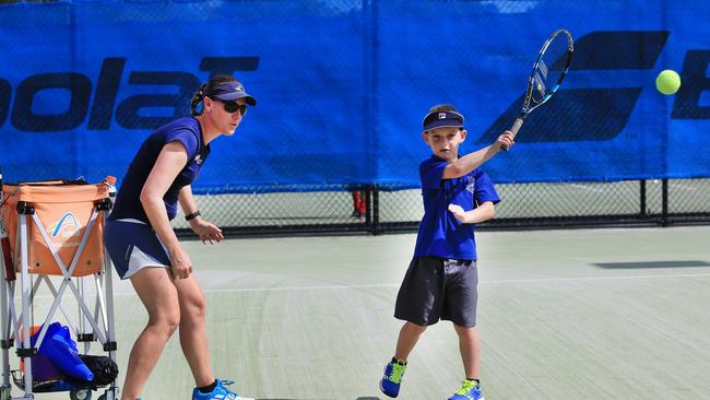 Murwillumbah tennis coach Gemma Eaton has been nominated by a community member for a shout out as an amazing Tweed woman for International Women's Day. She is pictured here with student Seth Sproule. Photo: Wendy Powick