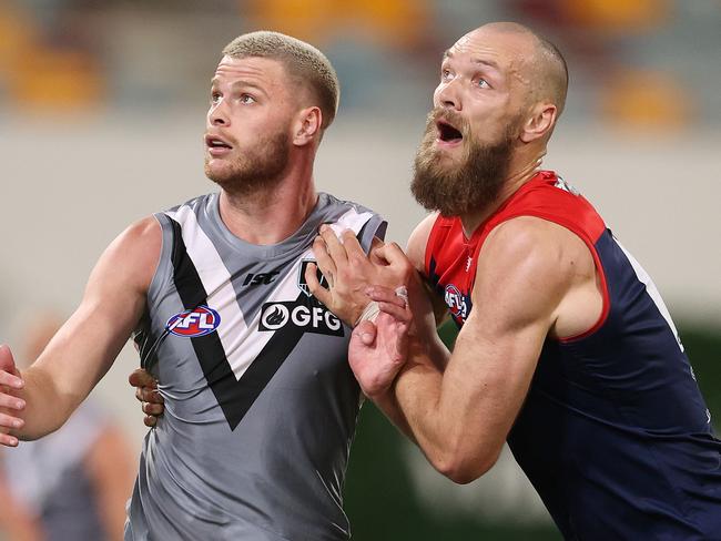 AFL Round 9. Melbourne vs Port Adelaide at the Gabba, Brisbane. 30/07/2020.   Peter Ladhams of the Power and Max Gawn of the Demons   . Pic: Michael Klein