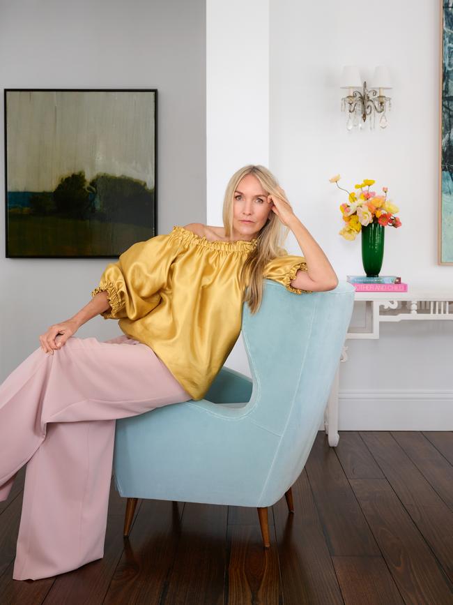 Many of the pieces in the home, such as the floorboards salvaged from a WA sheep station, have been collected by the designer over the years. Dinnigan wears Max Mara top and pants. Artwork by Alan Daniel Jones. Styling: Nicole Bonython-Hines. Picture: Earl Carter