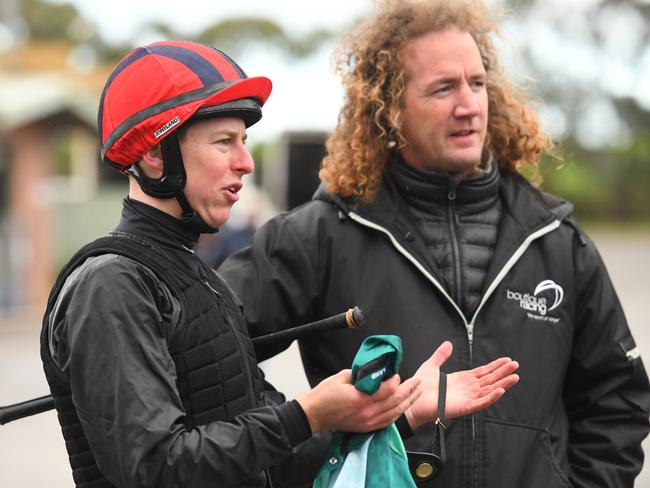 Damian Lane talks to trainer Ciaron Maher after riding Humidor in a barrier trial this month.