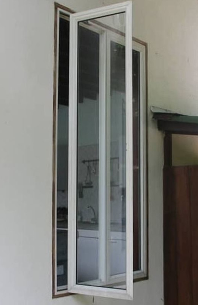 Police today released photos of a window they say was left open at the holiday resort cottage