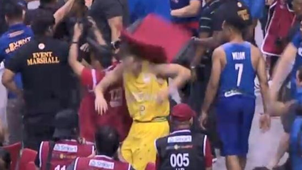 Australian Boomer Nathan Sobey cops a chair to the head during the wild brawl.
