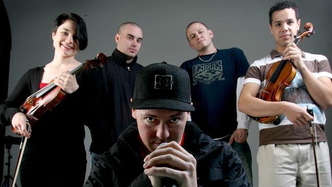 Hilltop Hoods members Suffa (hat), Pressure (white sleeves) and Debris (black jacket) with Graeme Norris and Janet Anderson from the members of the Adelaide Symphony Orchestra.