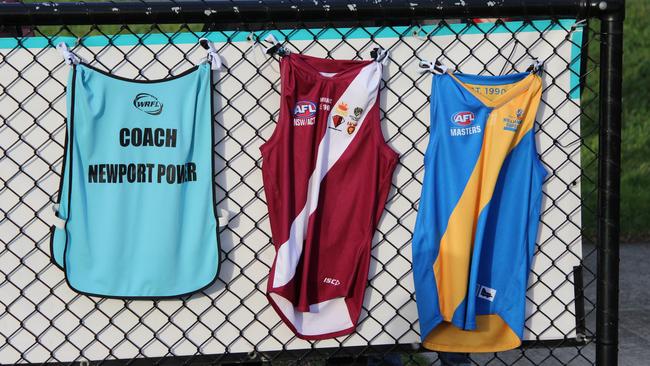 Sean Adams’ Newport Power coach's bib, old Manly Wolves jumper and Williamstown Superules jumper at a Newport Power match after his tragic accident.