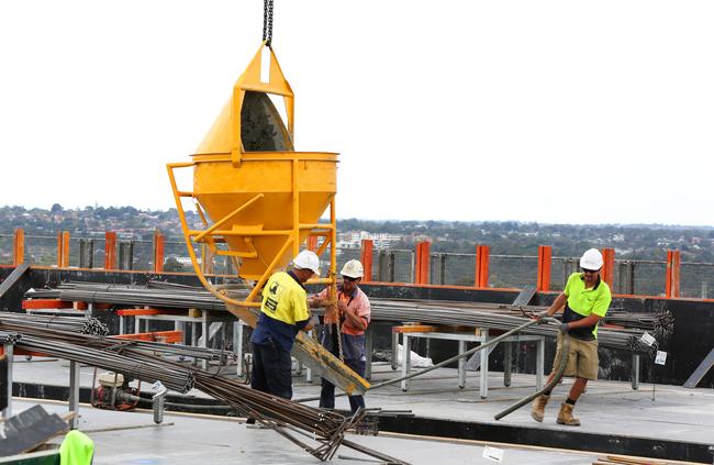 Construction staff pour concrete on top of the Flinders Centre. Picture: Angelo Velardo