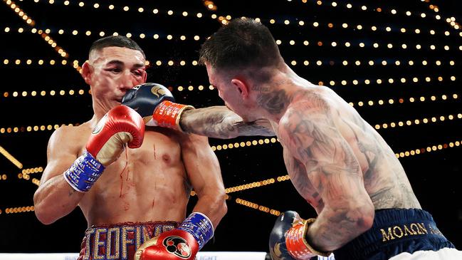 NEW YORK, NEW YORK - NOVEMBER 27: George Kambosos punches Teofimo Lopez during their championship bout for Lopezâ&#128;&#153;s Undisputed Lightweight title at The Hulu Theater at Madison Square Garden on November 27, 2021 in New York, New York. (Photo by Al Bello/Getty Images)