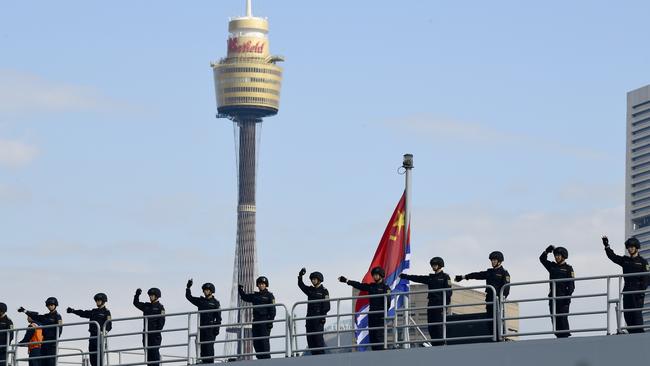 Chinese navy personnel are seen waving aboard a ship in Sydney in 2019. Picture: AAP