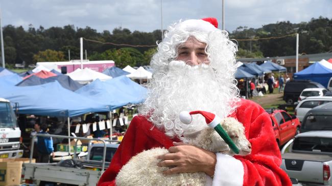 Santa Claus attends Narrabeen markets ahead of Christmas Day.