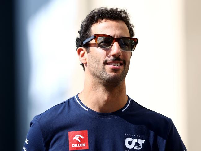 ABU DHABI, UNITED ARAB EMIRATES - NOVEMBER 24: Daniel Ricciardo of Australia and Scuderia AlphaTauri walks in the Paddock prior to practice ahead of the F1 Grand Prix of Abu Dhabi at Yas Marina Circuit on November 24, 2023 in Abu Dhabi, United Arab Emirates. (Photo by Clive Rose/Getty Images)