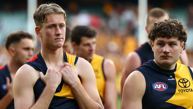 MELBOURNE, AUSTRALIA - JUNE 01: Brayden Cook and his Crows' team mates look dejected after losing the round 12 AFL match between Hawthorn Hawks and Adelaide Crows at Melbourne Cricket Ground, on June 01, 2024, in Melbourne, Australia. (Photo by Quinn Rooney/Getty Images)