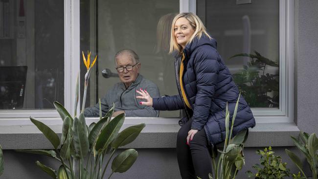 Rebecca Nielsen visits her grandpa, Maurice Purcell, at Bupa aged care in Bonbeach.