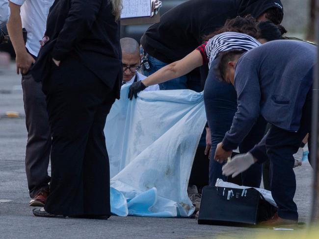 Investigators look at possible evidence near the American Reproductive Centers fertility clinic following a bomb blast in Palm Springs, California. Picture: Getty Images via AFP