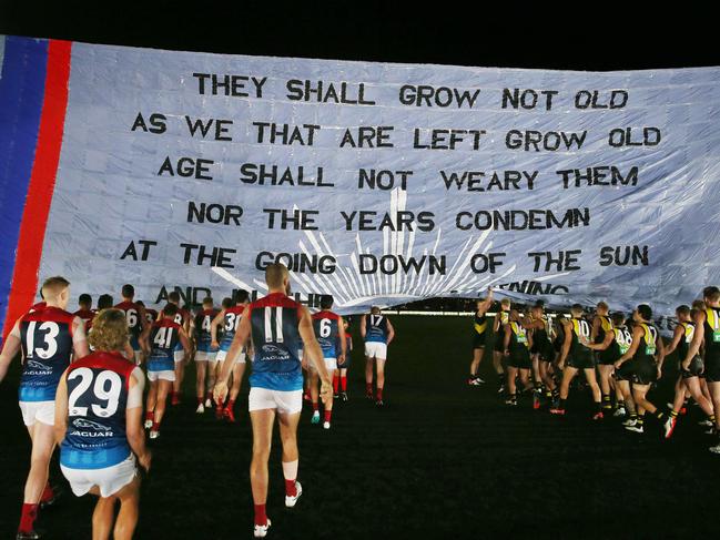 Both teams ran through the same banner. Picture: Michael Klein