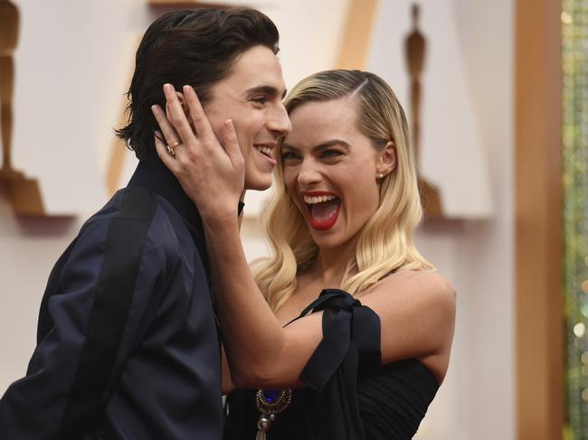 Timothee Chalamet, left, and Margot Robbie arrive at the Oscars Picture: AP