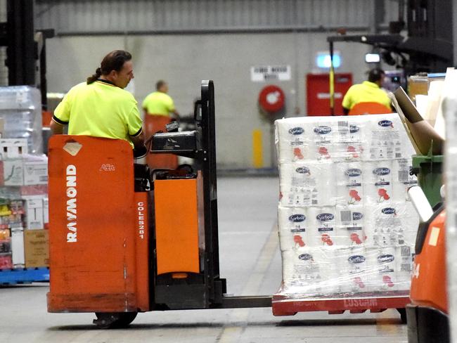 Coles Truganina Distribution Centre. Linfox forklift driver confirms that there is enough toilet paper for everyone. Coles chief operating officer Matt Swindells and Linfox Logistics chief executive officer Mark Mazurek. Picture: Tony Gough