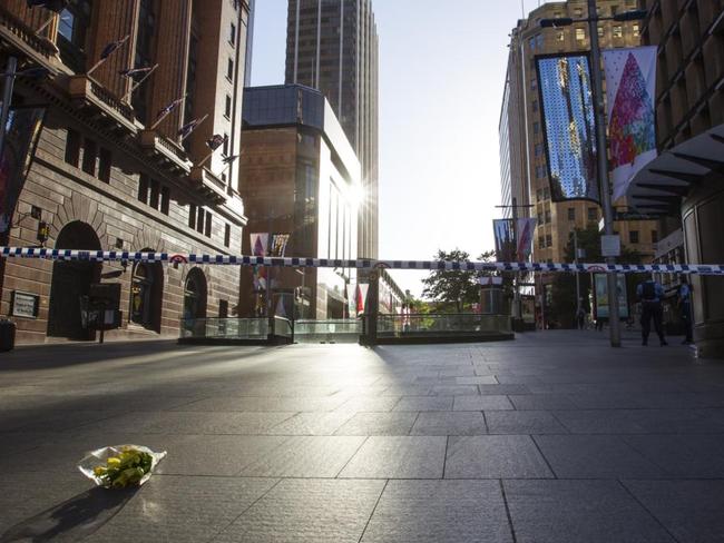 Flowers left at Martin Place. Picture by: Kate Dwek / Splash News