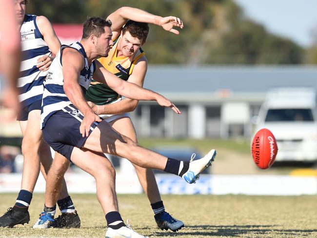 Pearcedale captain Travis Bravo kicks under pressure. Picture: Josie Hayden