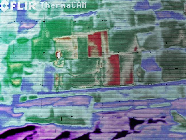 Live footage from a thermal camera of limestone blocks from the Khufu pyramid are displayed showing different colors representing varying temperatures during a press conference, in Giza, Egypt, Monday, Nov. 9, 2015. Egypt's Antiquities Ministry says a scanning project in the Giza pyramids has identified thermal anomalies, including one in the largest pyramid, built by Cheops, known locally as Khufu. (AP Photo/Nariman El-Mofty)