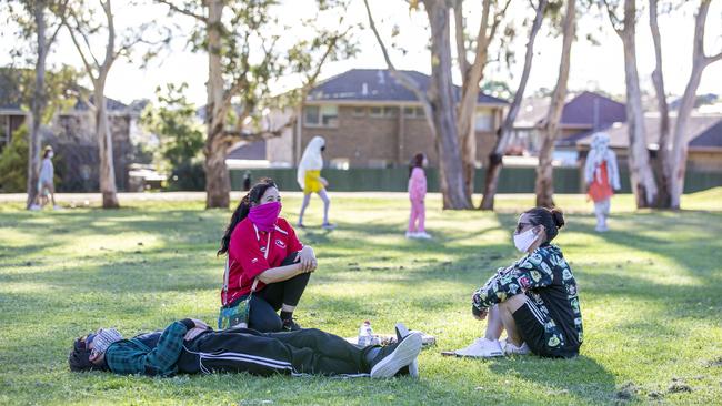 People relaxing at John Hemmings Memorial Park in Dandenong on the weekend. Picture: Tim Carrafa