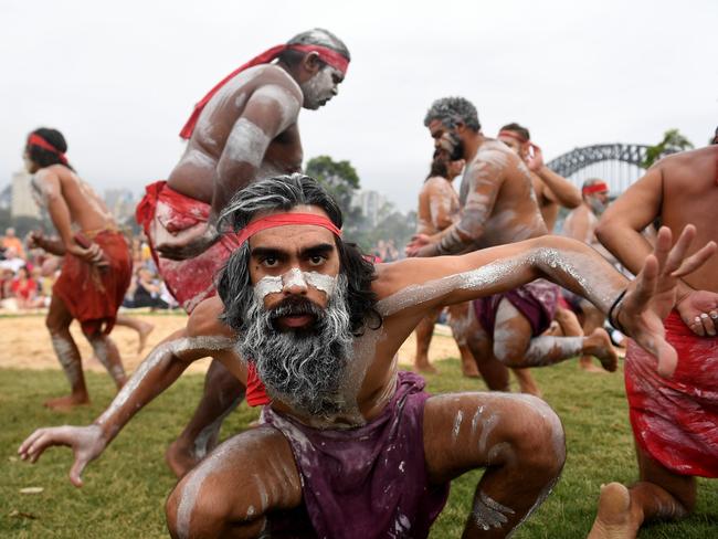 Koomurri people and representatives of aboriginal groups from around Australia perform the Smoking Ceremony and Dance during the WugulOra Morning Ceremony at Barangaroo Reserve as part of Australia Day celebrations in Sydney in 2017. Picture: AAP