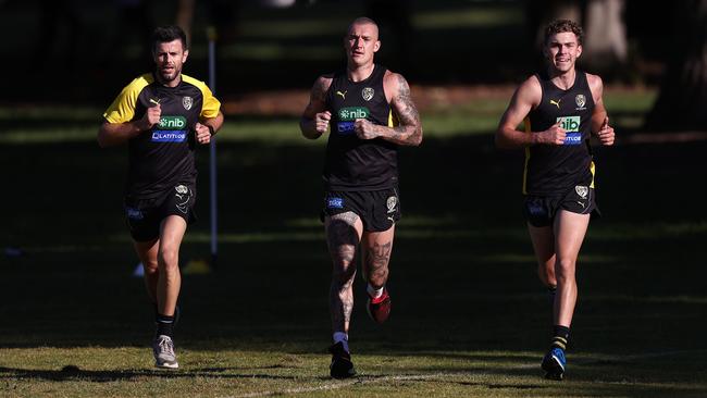 Dustin Martin, Trent Cotchin and Sam Banks run at training. Picture: Michael Klein