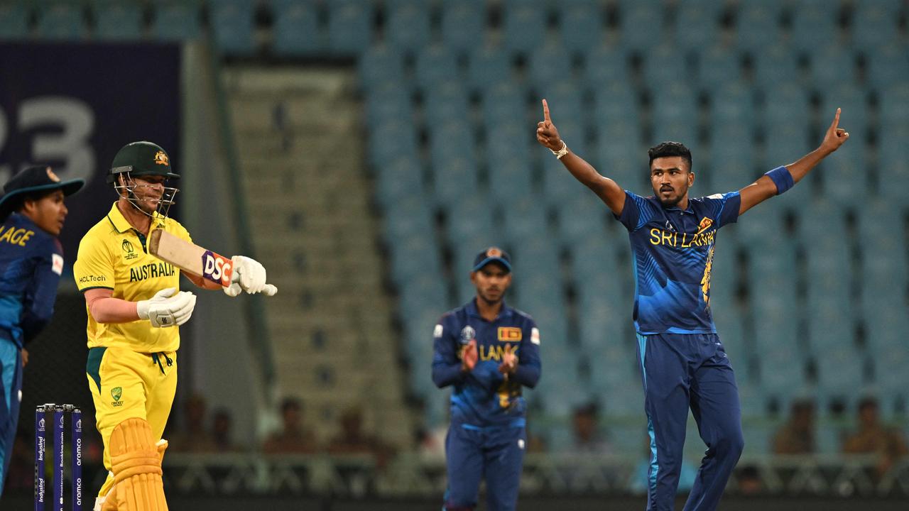 David Warner challenged the call immediately. Photo by Arun SANKAR / AFP.