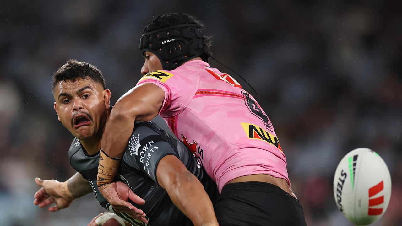 Latrell Mitchell throws an insane pass. (Photo by Cameron Spencer/Getty Images)