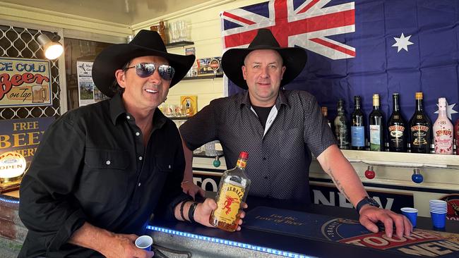 Lee Kernaghan, left, with his friend and No.1 fan Troy Hofmeier at his general store in Texas which he bought after hearing the song of the same name.